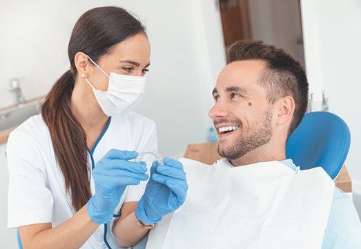 dentist and patient discussing how much do clear aligners cost in Arlington Heights 
