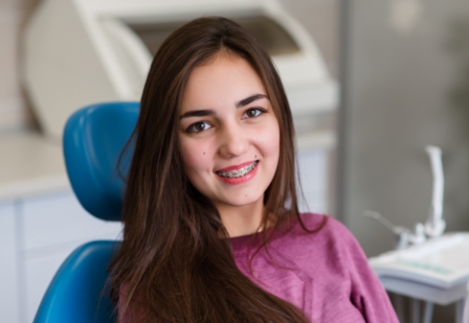Teen with metal braces smiling